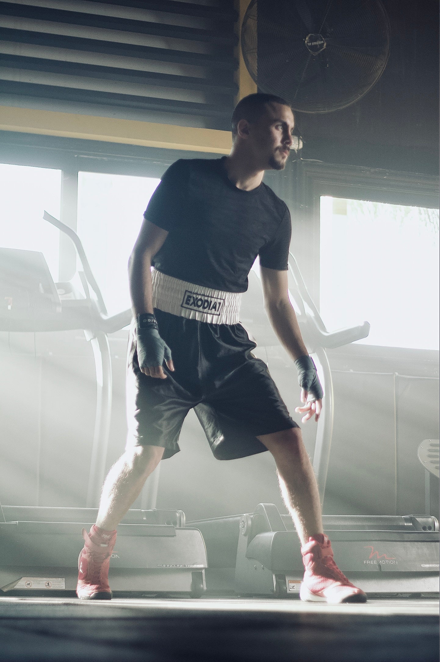 Boxer training in Exodia 1 Black/White Satin Boxing Shorts - Designed for comfort, flexibility, and peak performance.